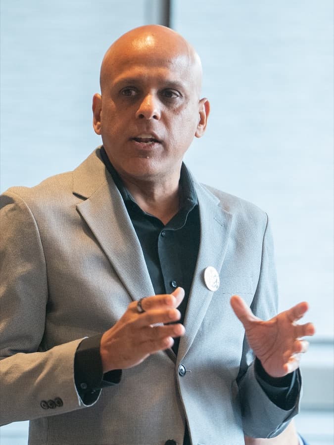 Manuj Aggarwal speaking at a technology event